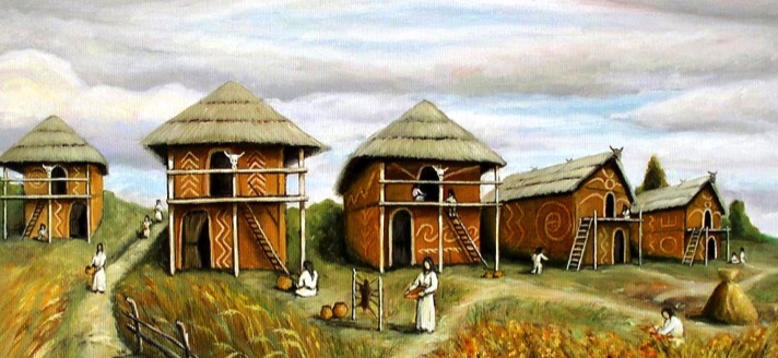 Depiction of reconstructed Trypillian dwellings — typical two-story clay houses with thatched roofs and geometric ornamentation, based on archaeological findings.